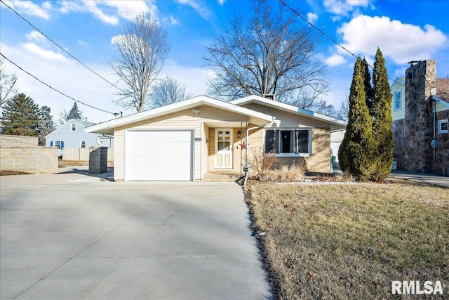 ranch-style home with a garage and a front yard