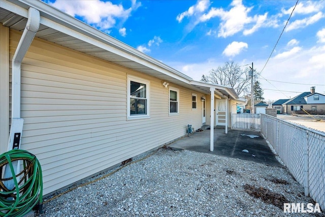 view of side of property featuring a patio area