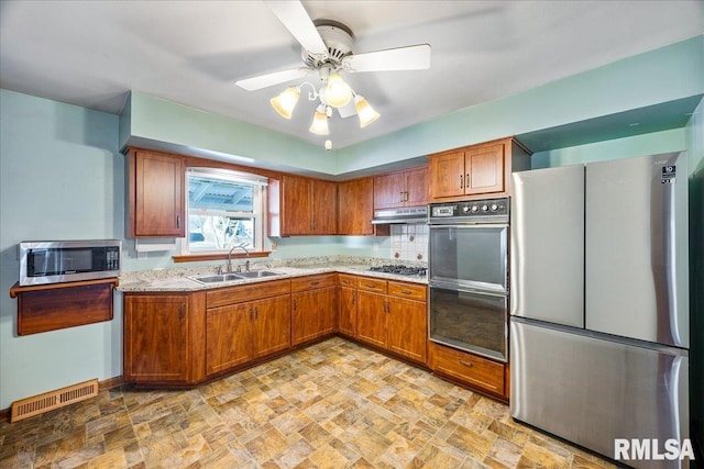 kitchen with ceiling fan, appliances with stainless steel finishes, and sink