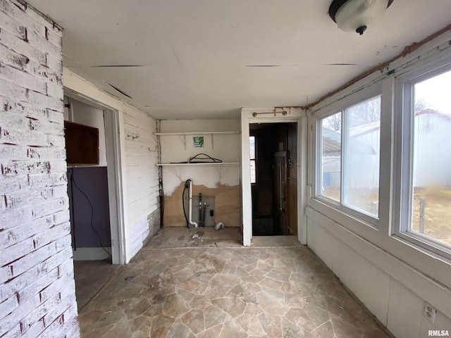 unfurnished sunroom featuring a healthy amount of sunlight