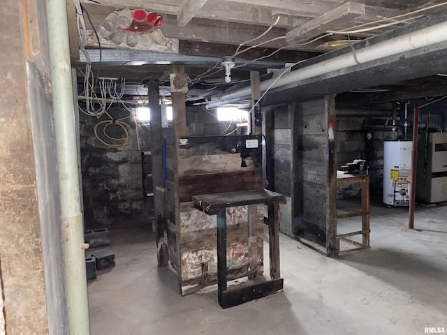 basement featuring heating unit and gas water heater