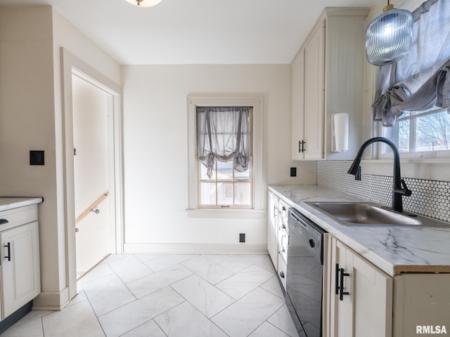 kitchen featuring white cabinetry, dishwasher, sink, decorative backsplash, and hanging light fixtures