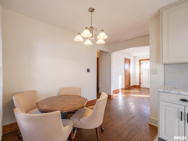 dining room featuring an inviting chandelier and wood-type flooring