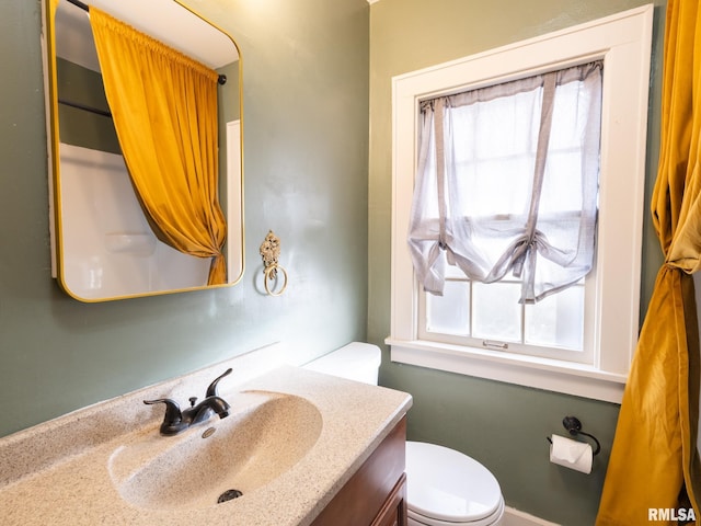 bathroom with vanity and toilet