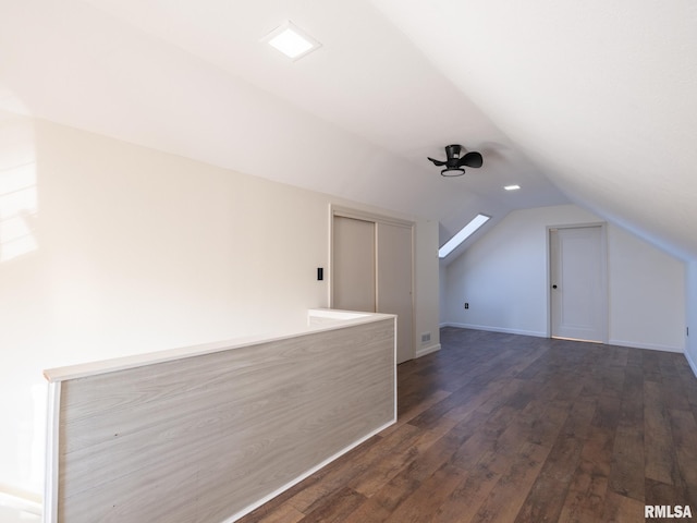 additional living space with lofted ceiling and dark hardwood / wood-style flooring