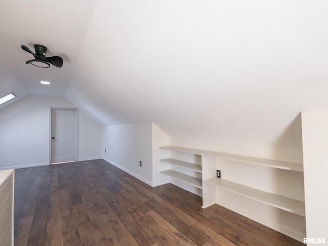 bonus room featuring dark wood-type flooring, ceiling fan, and vaulted ceiling