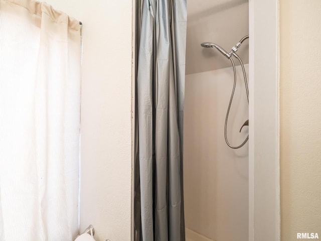 bathroom featuring walk in shower