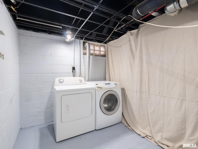 clothes washing area with independent washer and dryer