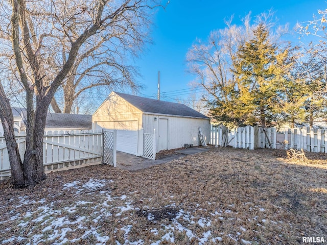 exterior space with an outbuilding and a garage