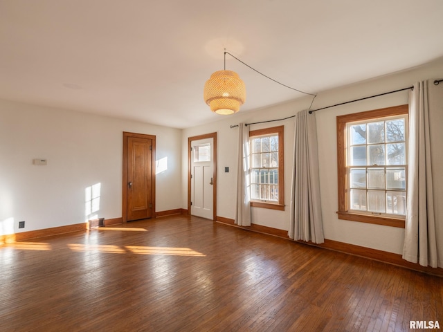 unfurnished room featuring dark hardwood / wood-style flooring