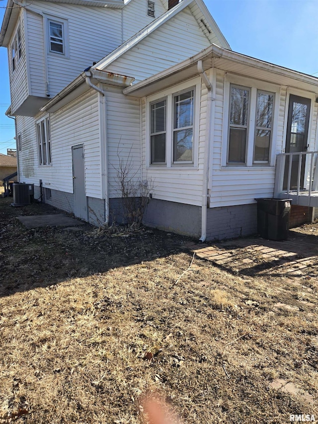 view of home's exterior with cooling unit