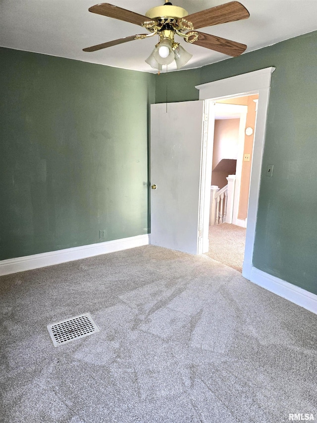 unfurnished room featuring carpet and ceiling fan