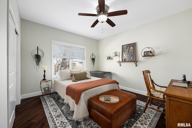 bedroom featuring ceiling fan, dark wood finished floors, and baseboards