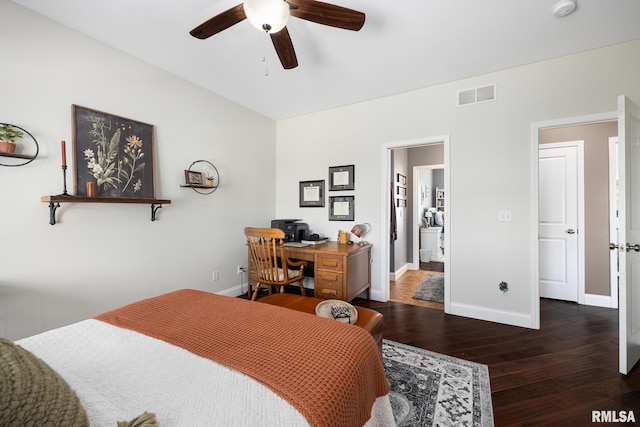 bedroom with dark wood-style floors, visible vents, baseboards, and a ceiling fan