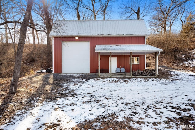 view of snow covered garage