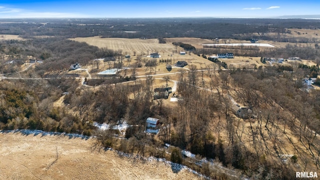 birds eye view of property with a rural view