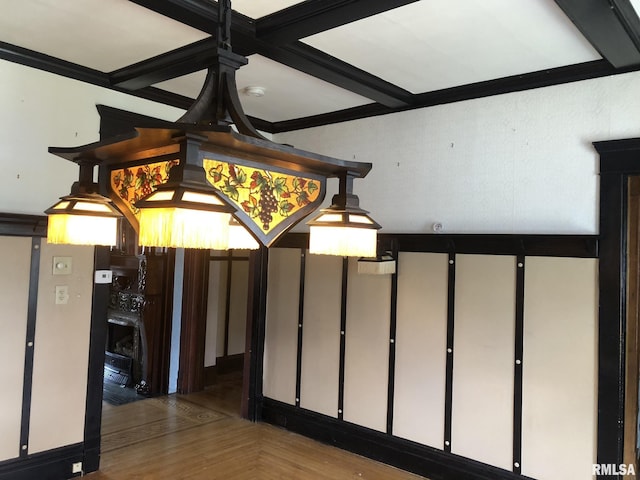 interior space featuring hardwood / wood-style flooring and ornamental molding