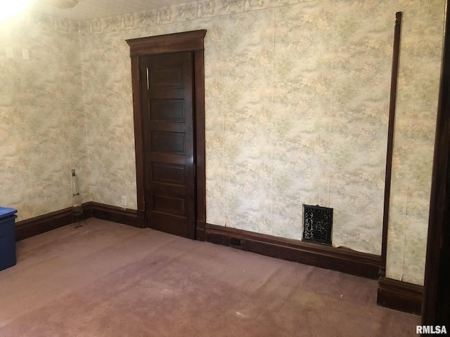 empty room featuring carpet floors