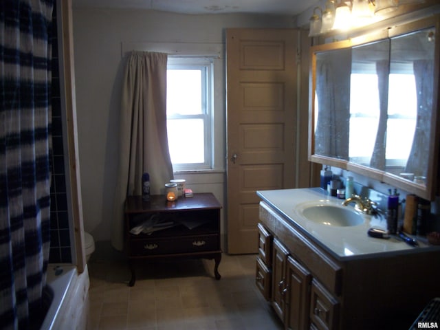 full bathroom featuring vanity, toilet, and shower / bath combo