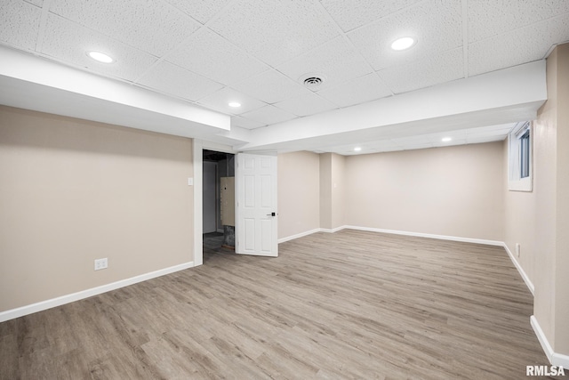 basement featuring wood-type flooring