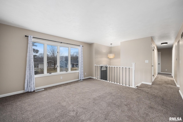 spare room featuring carpet flooring