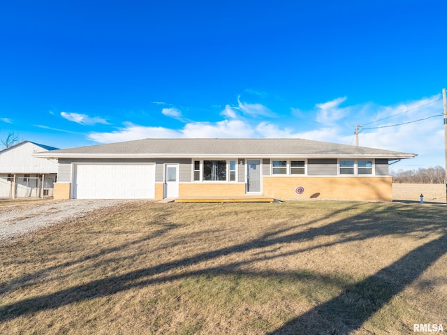 ranch-style home with a garage and a front yard