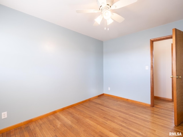 spare room featuring ceiling fan and light wood-type flooring