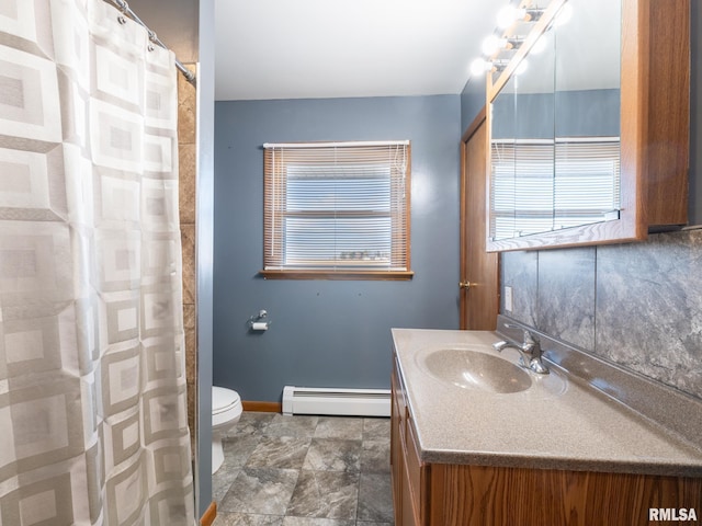 bathroom with a baseboard radiator, vanity, and toilet