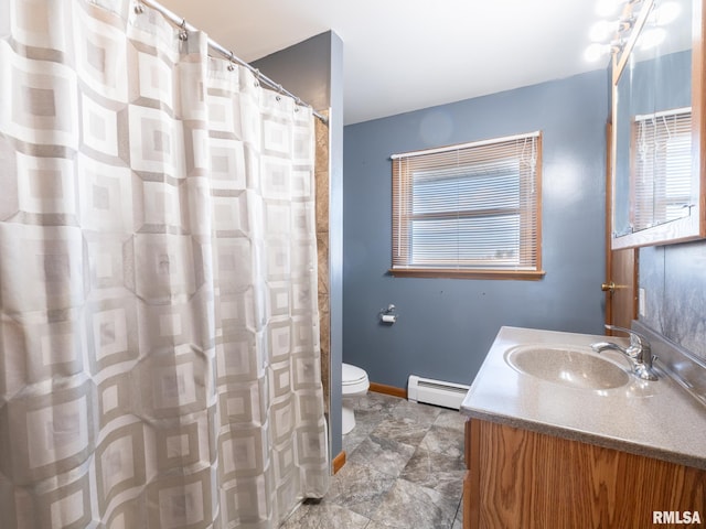 bathroom featuring baseboard heating, vanity, and toilet