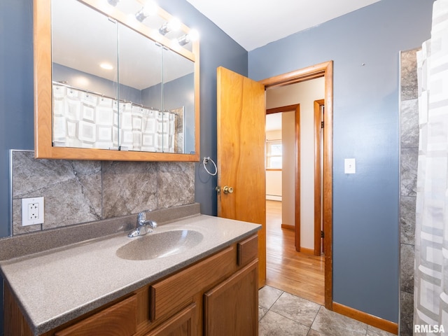 bathroom featuring tasteful backsplash, tile patterned floors, vanity, and curtained shower