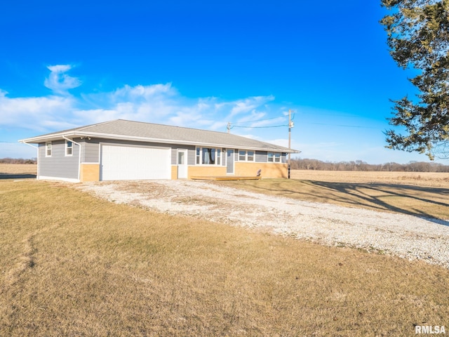 ranch-style home with a garage and a front yard