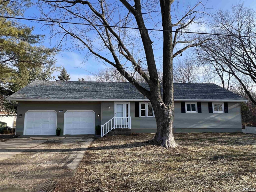 single story home with a garage