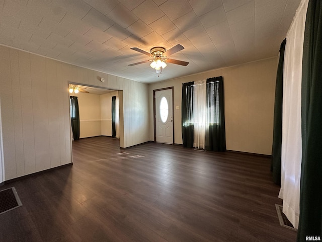 interior space featuring ceiling fan and dark hardwood / wood-style flooring