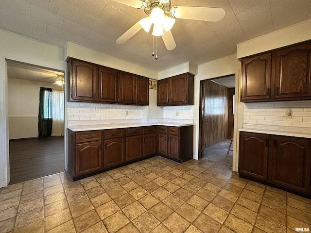 kitchen featuring tasteful backsplash, ceiling fan, and dark brown cabinetry