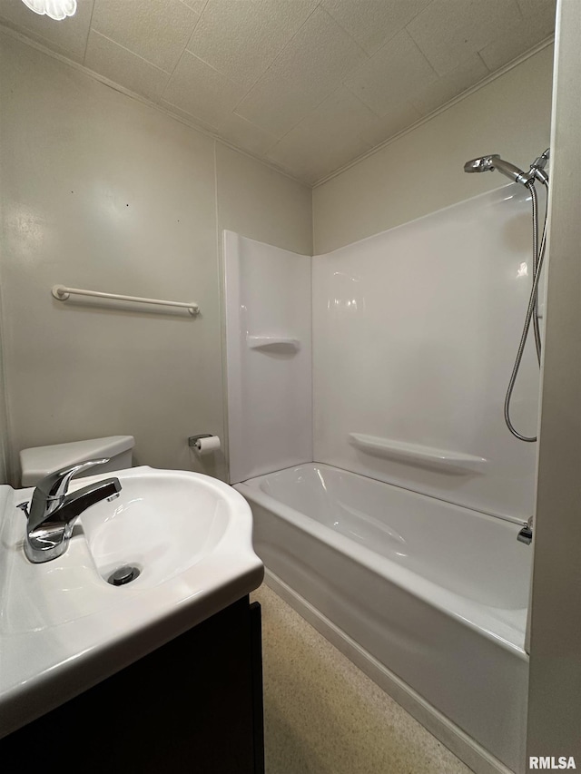 full bathroom featuring sink, bathtub / shower combination, and toilet