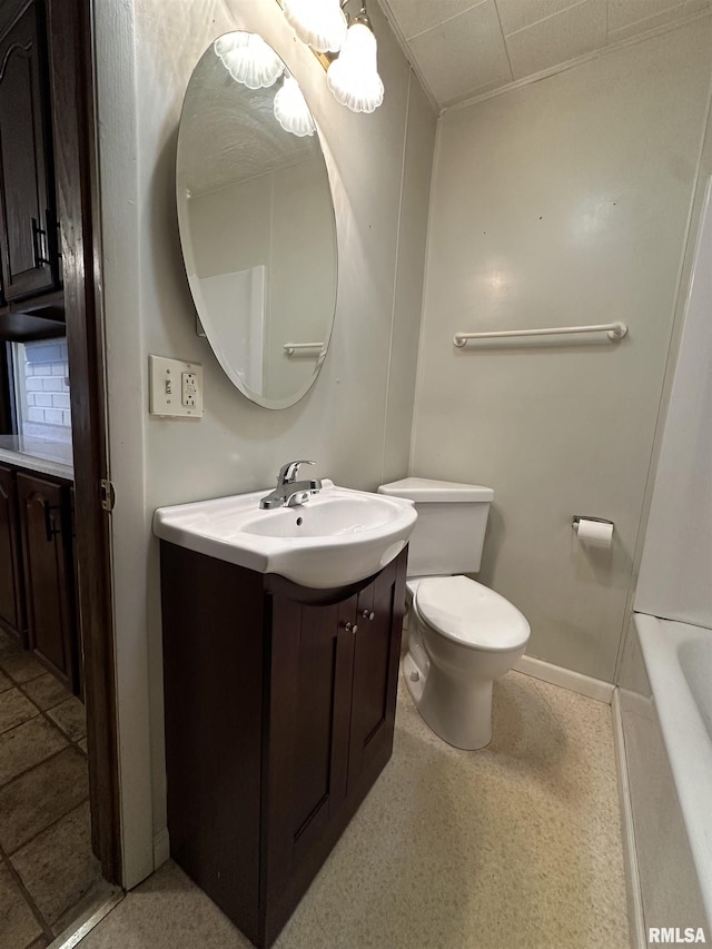 bathroom with a tub to relax in, vanity, toilet, and decorative backsplash