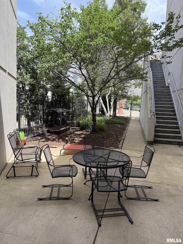 316 SW Washington St Unit 603, Peoria, IL 61602 - view of patio / terrace with a gate and outdoor dining area