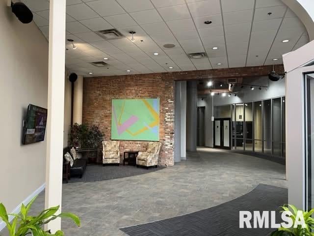 316 SW Washington St Unit 603, Peoria, IL 61602 - common area with recessed lighting and brick wall