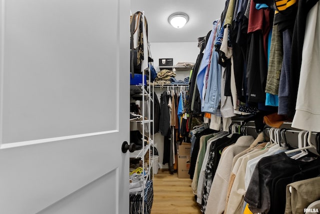 walk in closet featuring light hardwood / wood-style floors