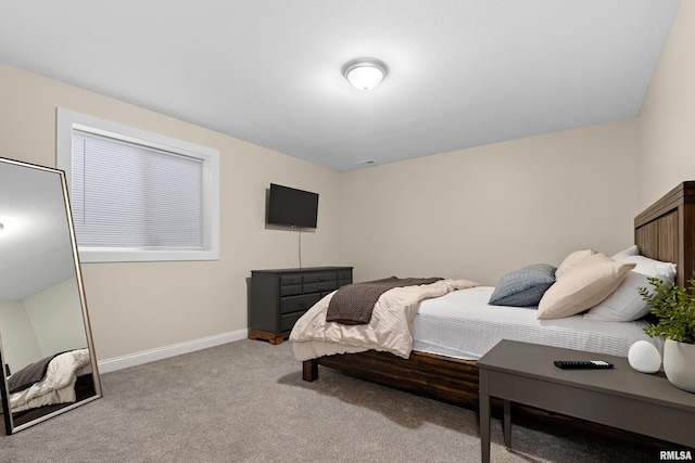 bedroom with light colored carpet