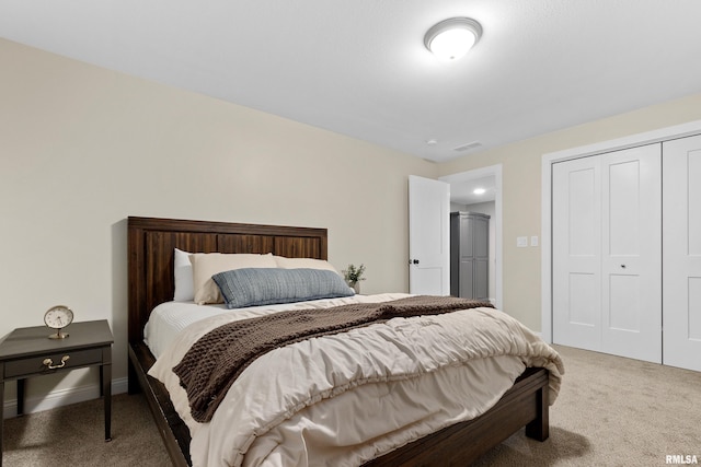 carpeted bedroom with a closet