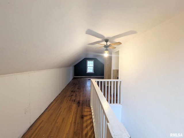 bonus room with lofted ceiling and dark hardwood / wood-style floors