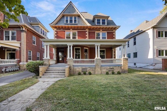 view of front of house featuring a front yard and a porch