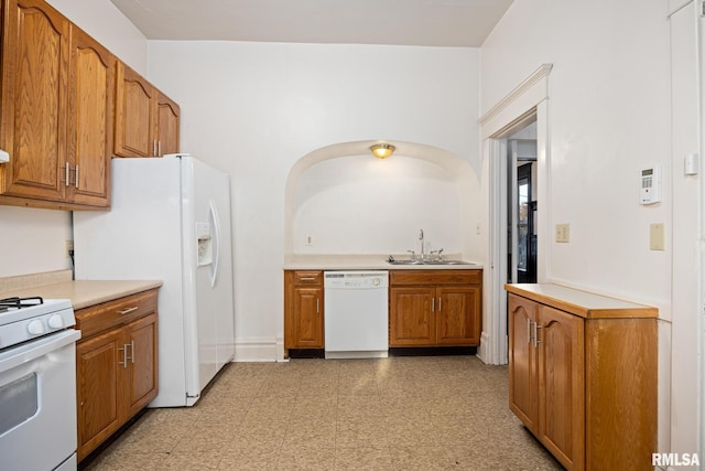 kitchen featuring sink and white appliances