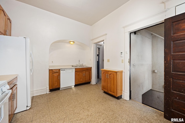 kitchen with white appliances and sink