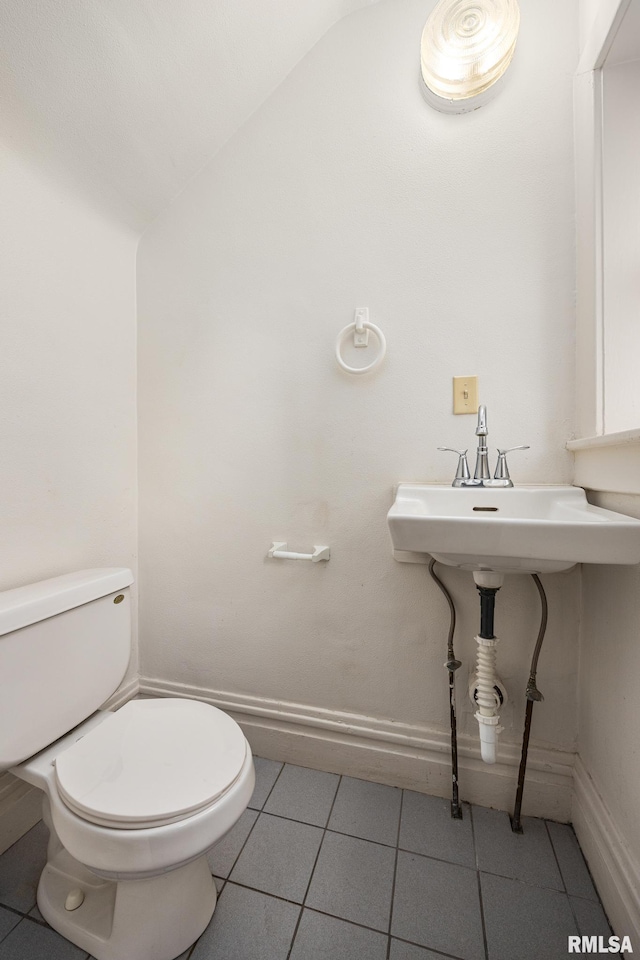 bathroom with tile patterned floors and toilet