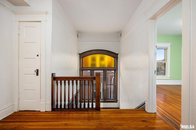 corridor with wood-type flooring