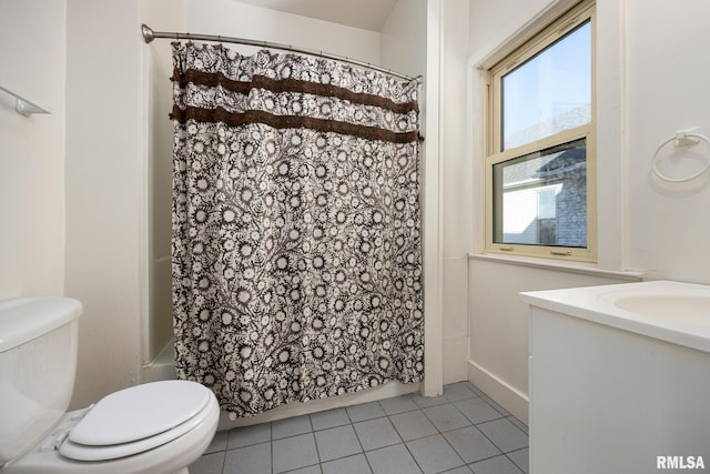 full bathroom featuring vanity, shower / tub combo, tile patterned floors, and toilet