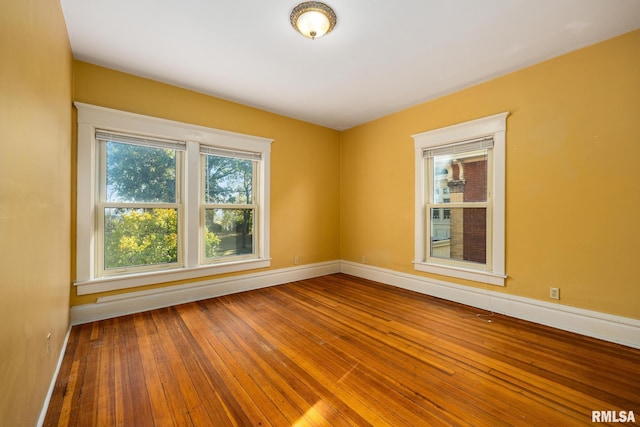 unfurnished room featuring hardwood / wood-style floors