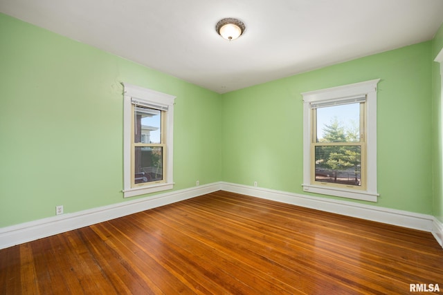 spare room featuring hardwood / wood-style floors